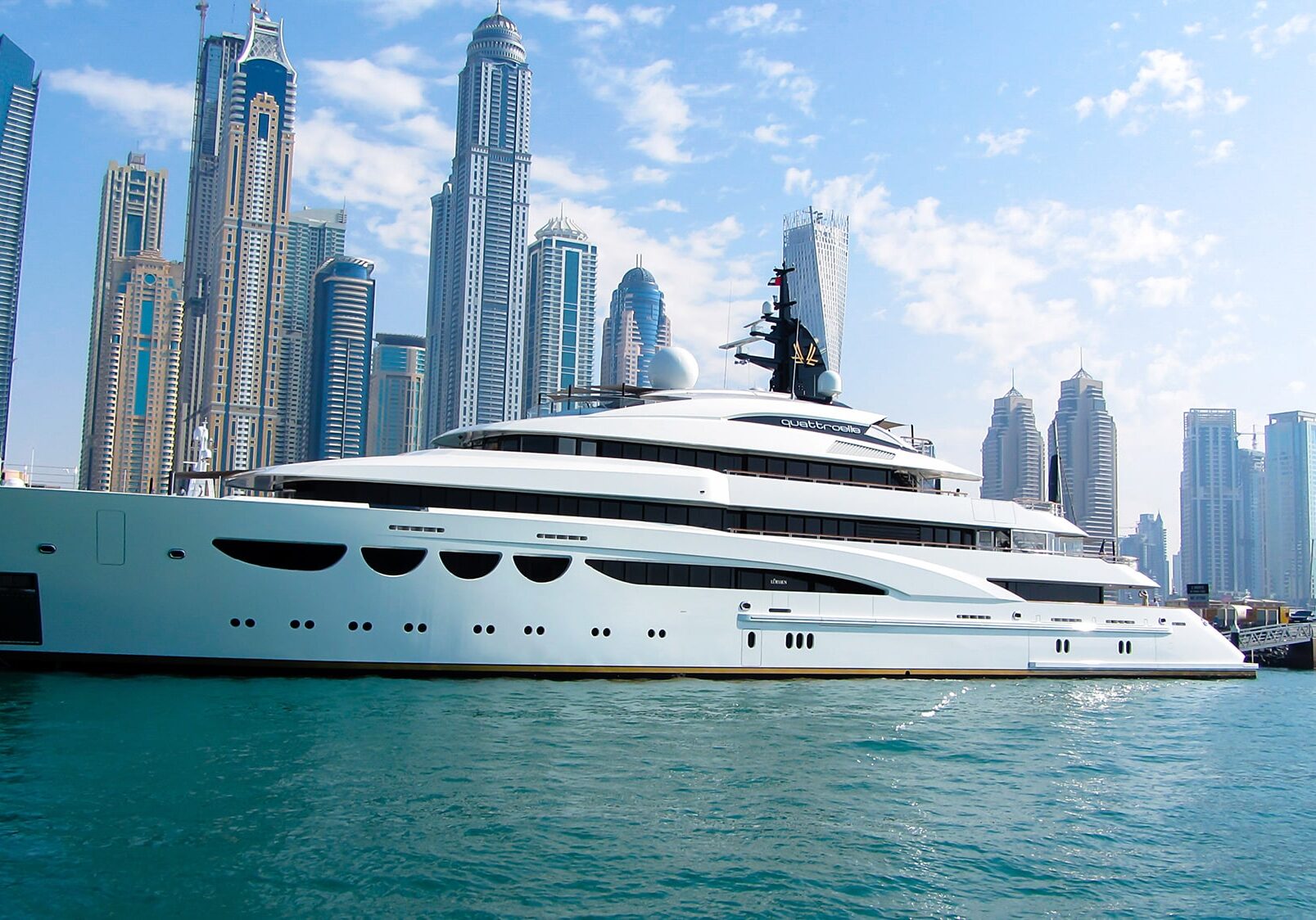 Yacht in dubai marina in front of high-rise buildings on 26th November 2016