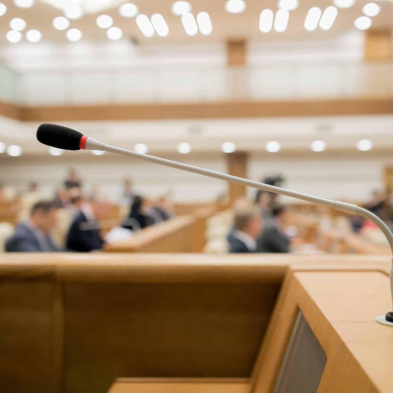 Session of Government. Conference room or seminar meeting room in business event. Academic classroom training course in lecture hall. blurred businessmen talking. modern bright office indoor