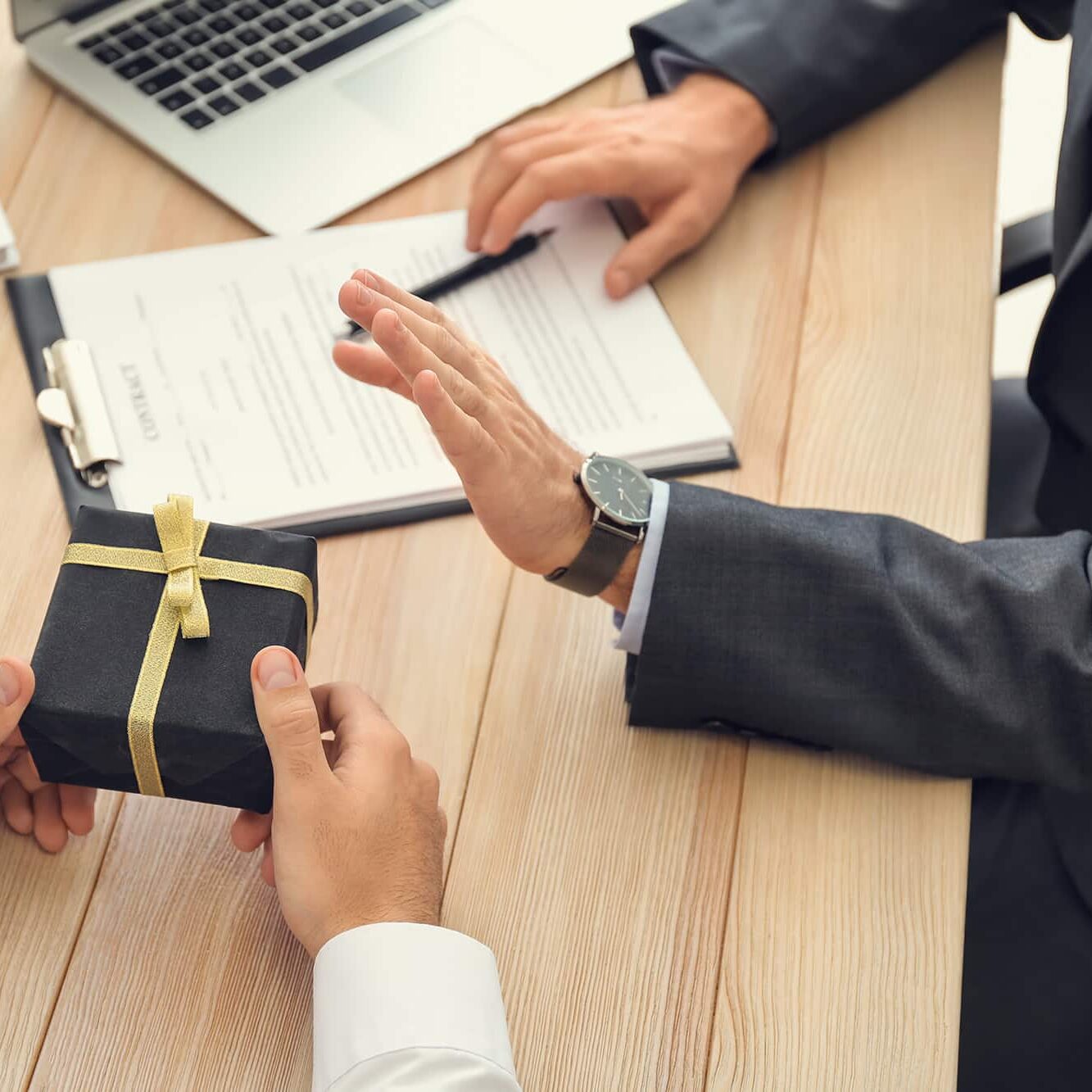 Businessman refusing to take bribe in office. Concept of corruption