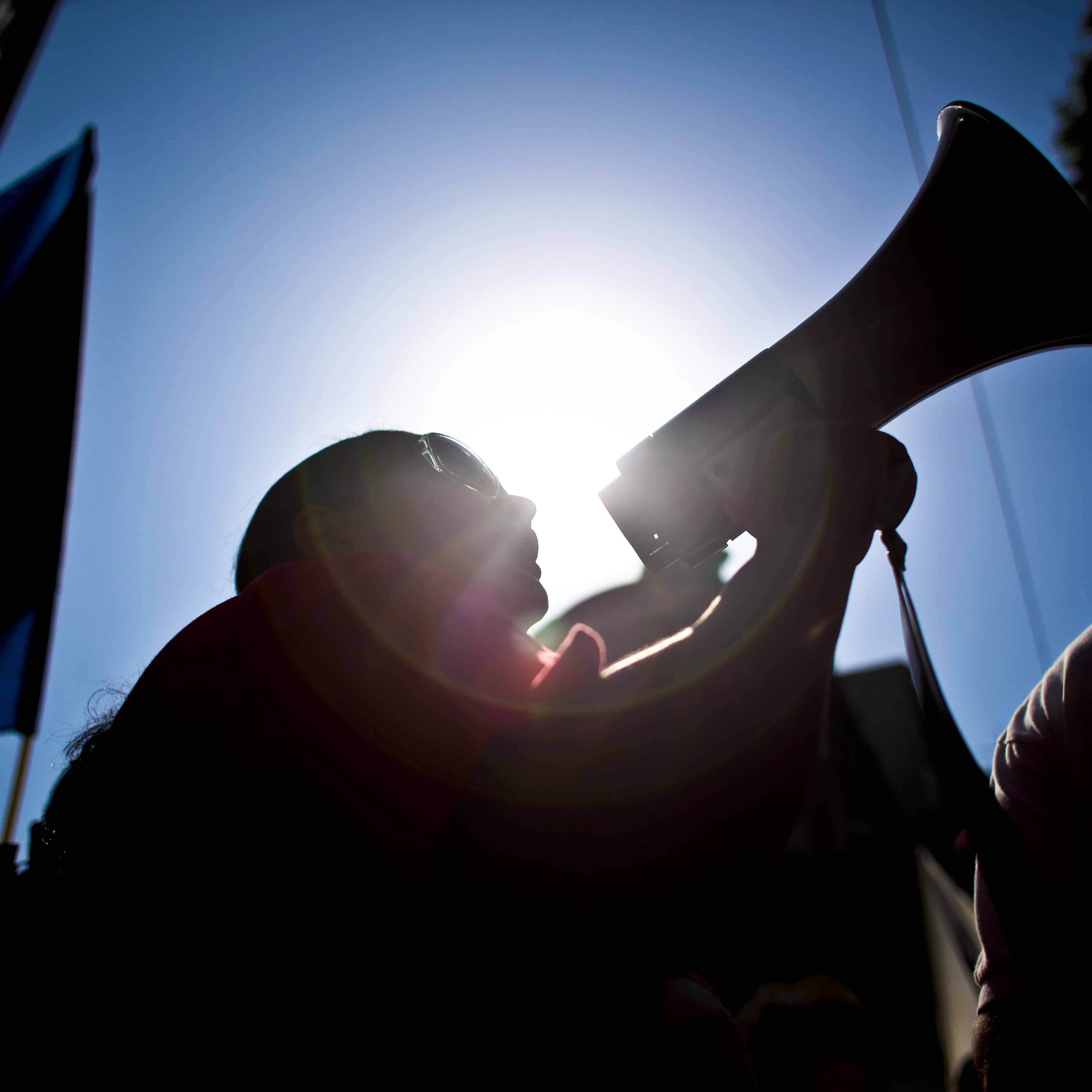 A worker uses a loudspeaker as he protests with thousands counterparts against government austerity measures during demonstrations launched by Portugal's biggest trade union called Portuguese General Workers Confederation (CGTP), in Lisbon, on July 8, 2010. AFP PHOTO/ PATRICIA DE MELO MOREIRA (Photo credit should read PATRICIA DE MELO MOREIRA/AFP/Getty Images)